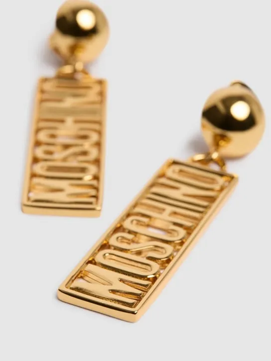Moschino   Plate logo drop earrings 
