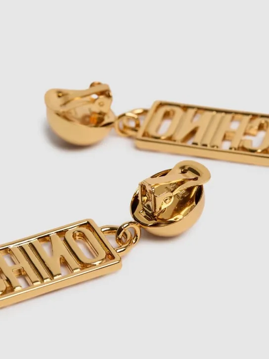 Moschino   Plate logo drop earrings 